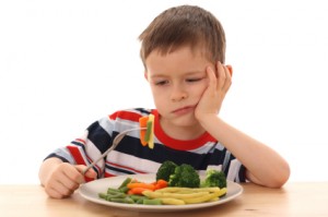 boy and cooked vegetables